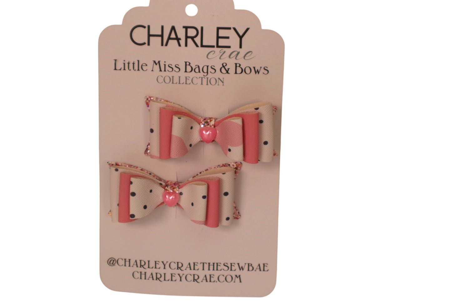 Handmade faux leather pink and white sweetheart pigtail hair bows