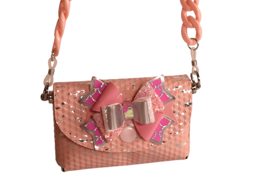 Tiny pink child’s handmade crossbody bag with 2 matching pigtail bows