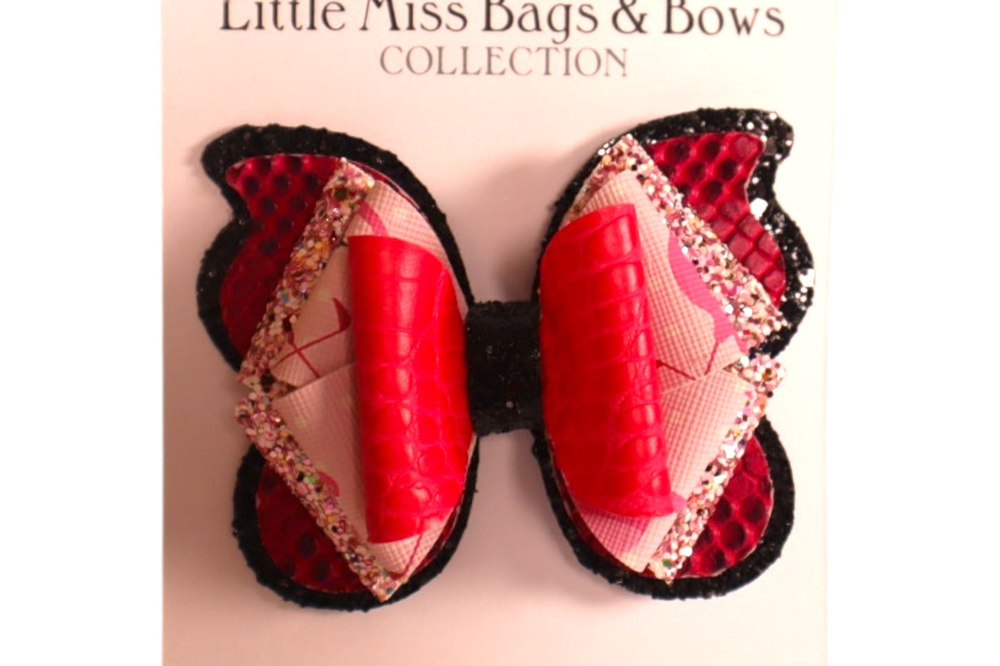 Handmade 4” pink faux snake skin butterfly hairbow
