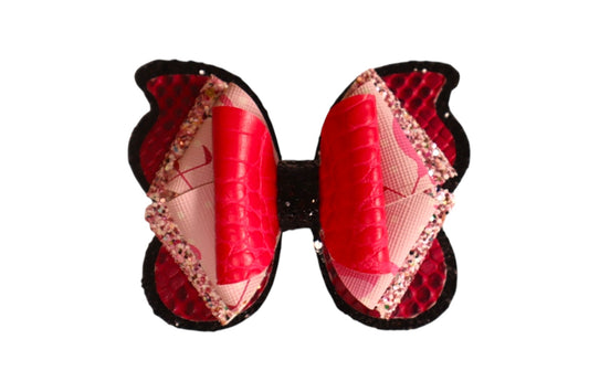 Handmade 4” pink faux snake skin butterfly hairbow