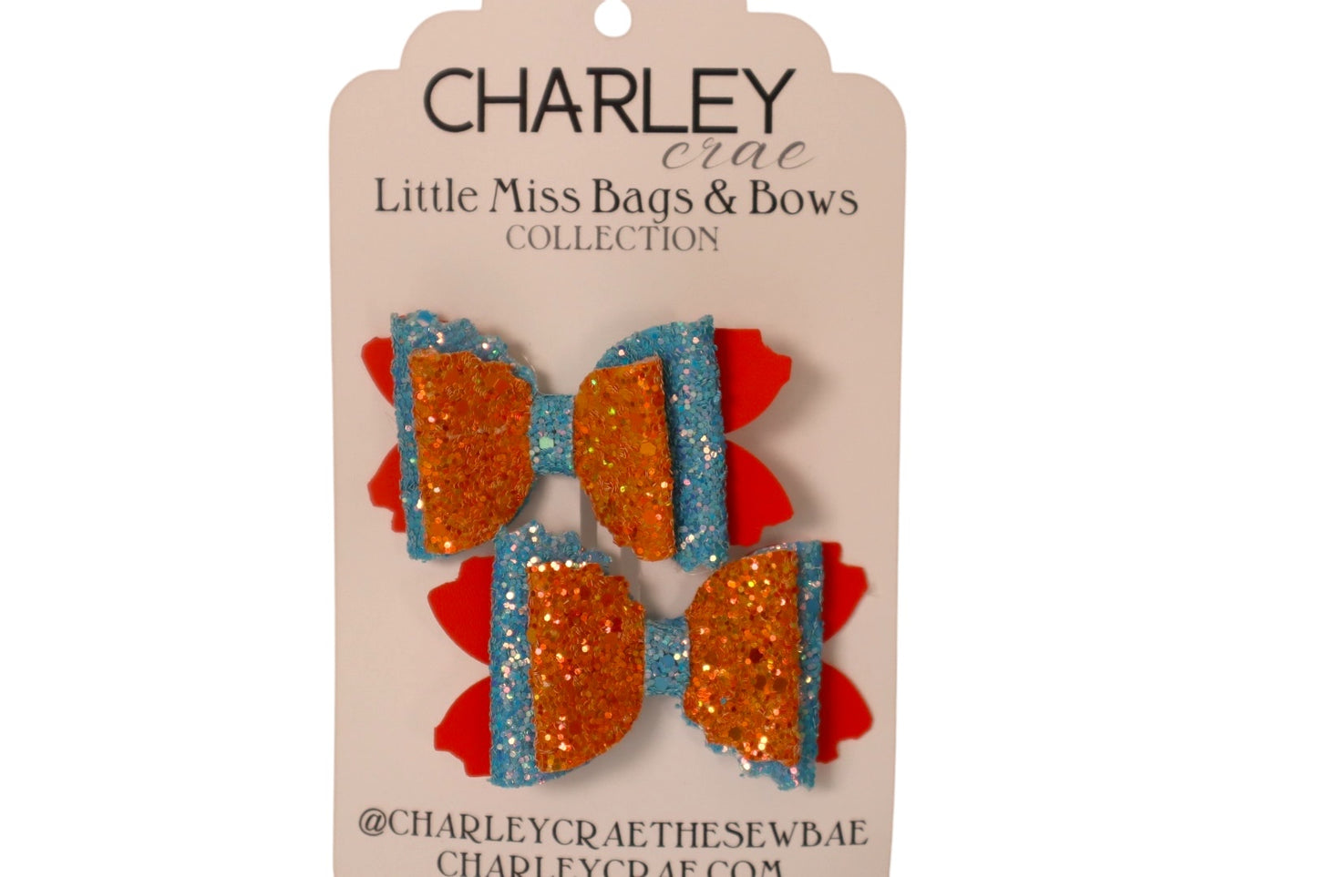 Handmade orange and blue sparkling pigtail hair bows